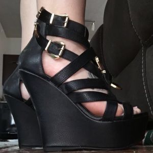 Black strap wedges with gold buckle
